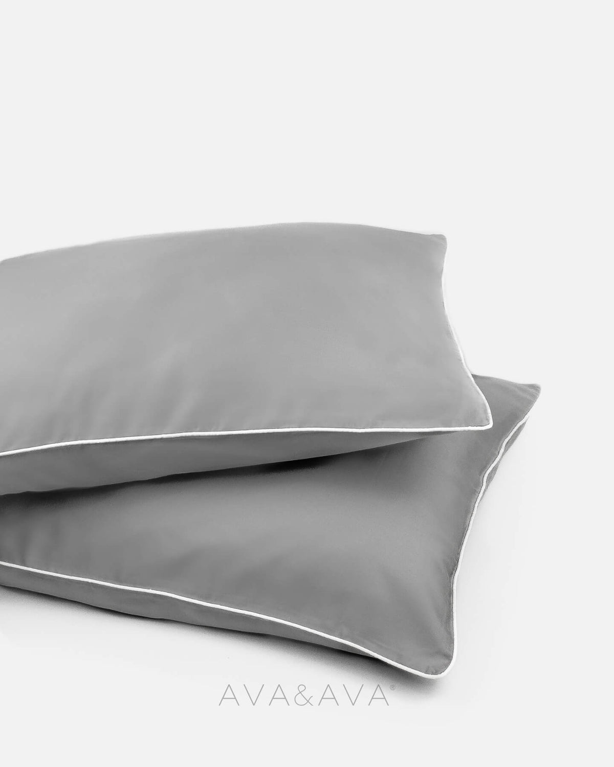 pair of organic bamboo lyocell pillowcases with GRAY WITH WHITE piping. ava and ava ph vegan silk, soft, cool, smooth, breathable pillowcases.