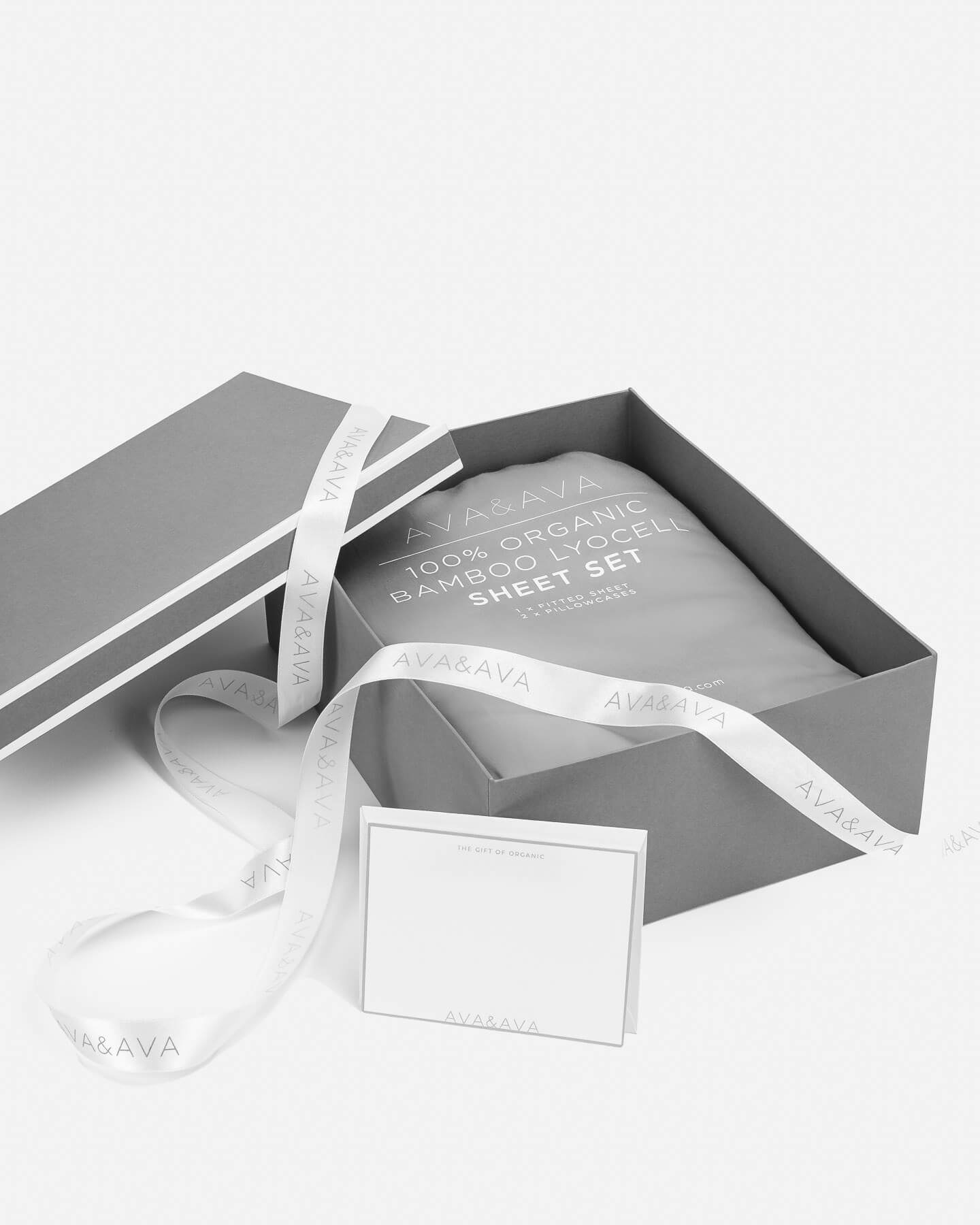 medium gray gift box with white piping, white satin ribbon and card, organic bamboo lyocell sheet set inside. gift for mothers day / fathers day / birthday / wedding / grandparents