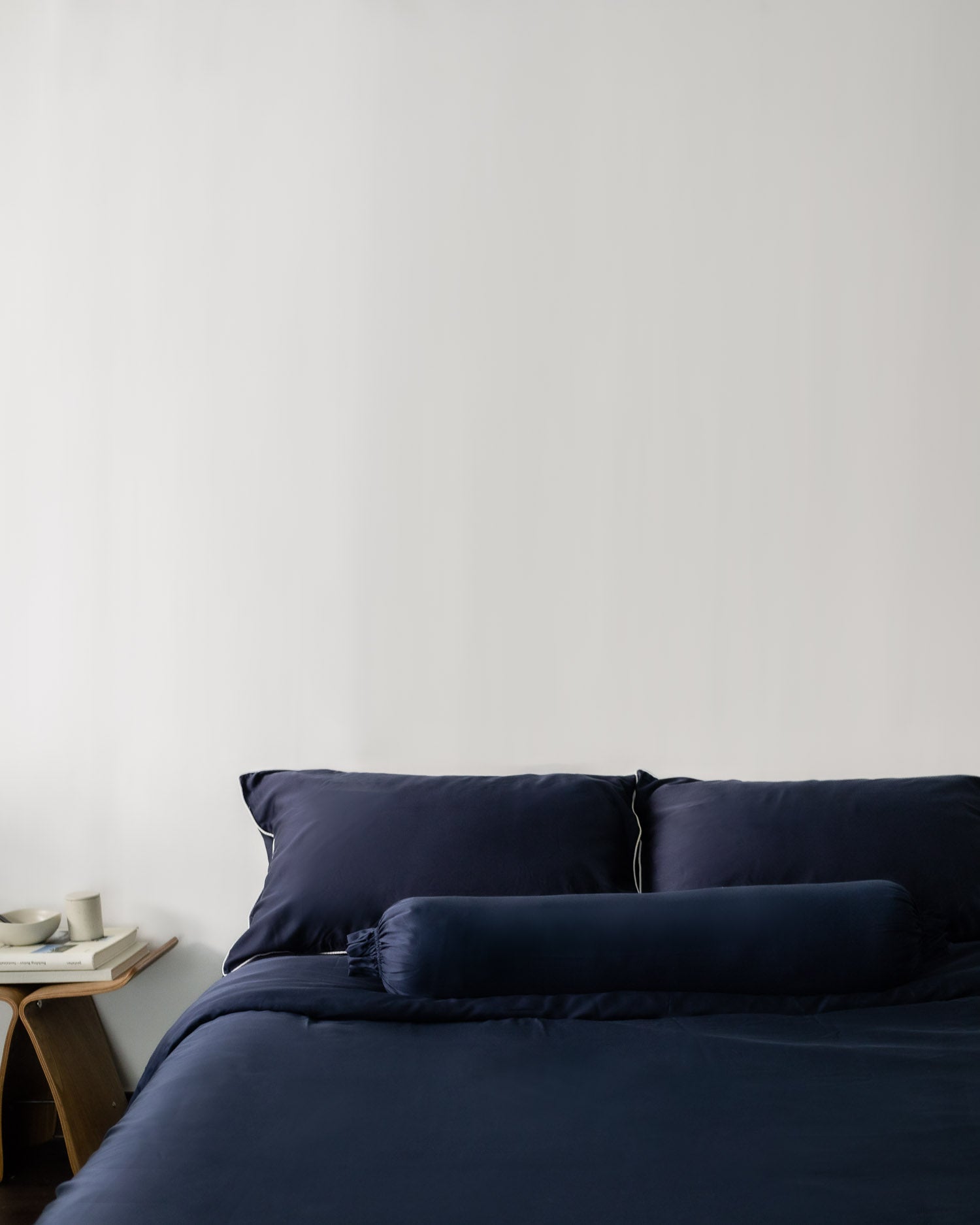 ava and ava philippines ph organic bamboo lyocell bolster pillow / hotdog pillow / long pillow / po-tsim pillow in navy blue with navy bed sheets, pillowcases and duvet cover