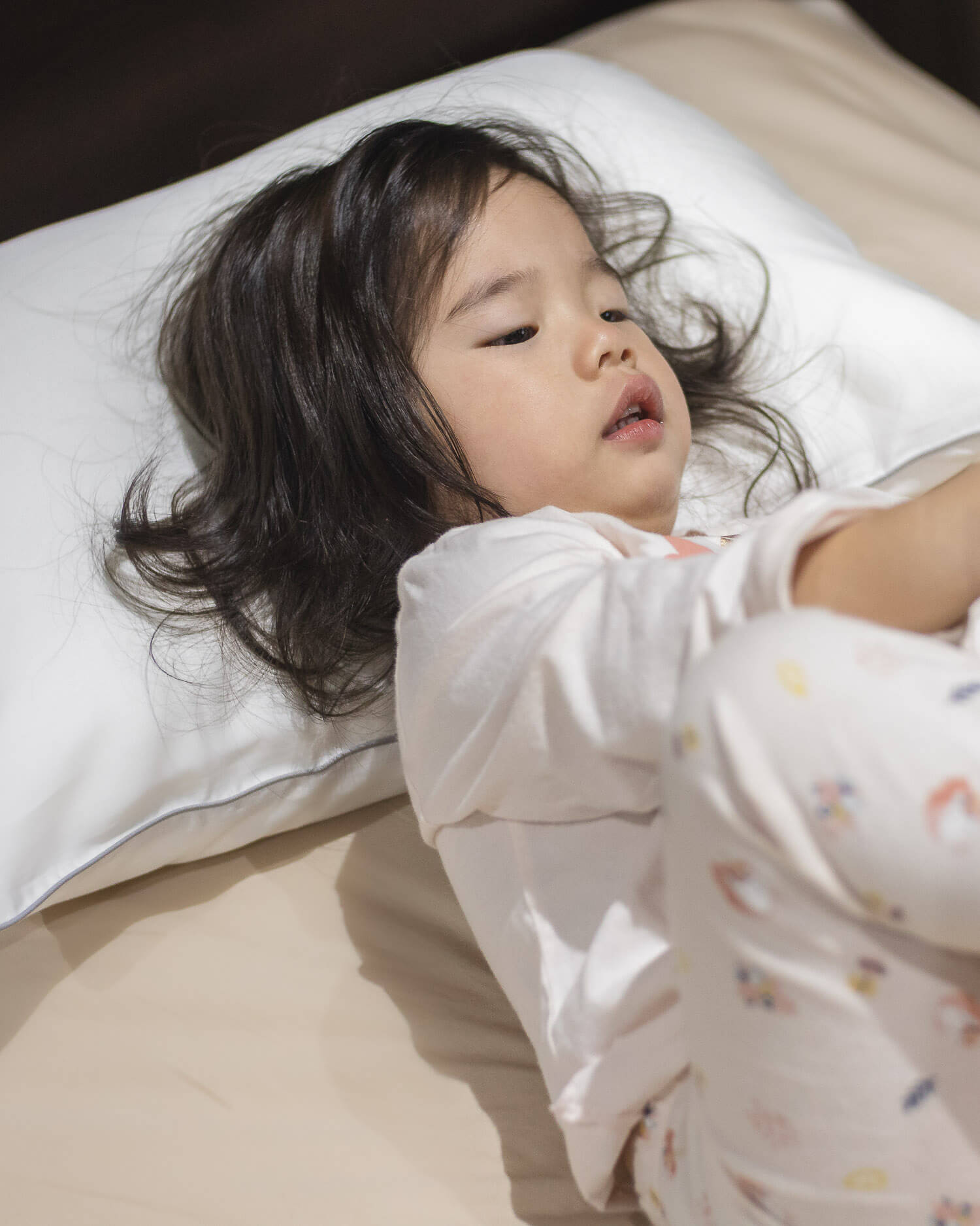 ava and ava ph ava & ava ph organic bamboo lyocell hypoallergenic toddler pillow white pillowcase with gray piping with baby lying in bed