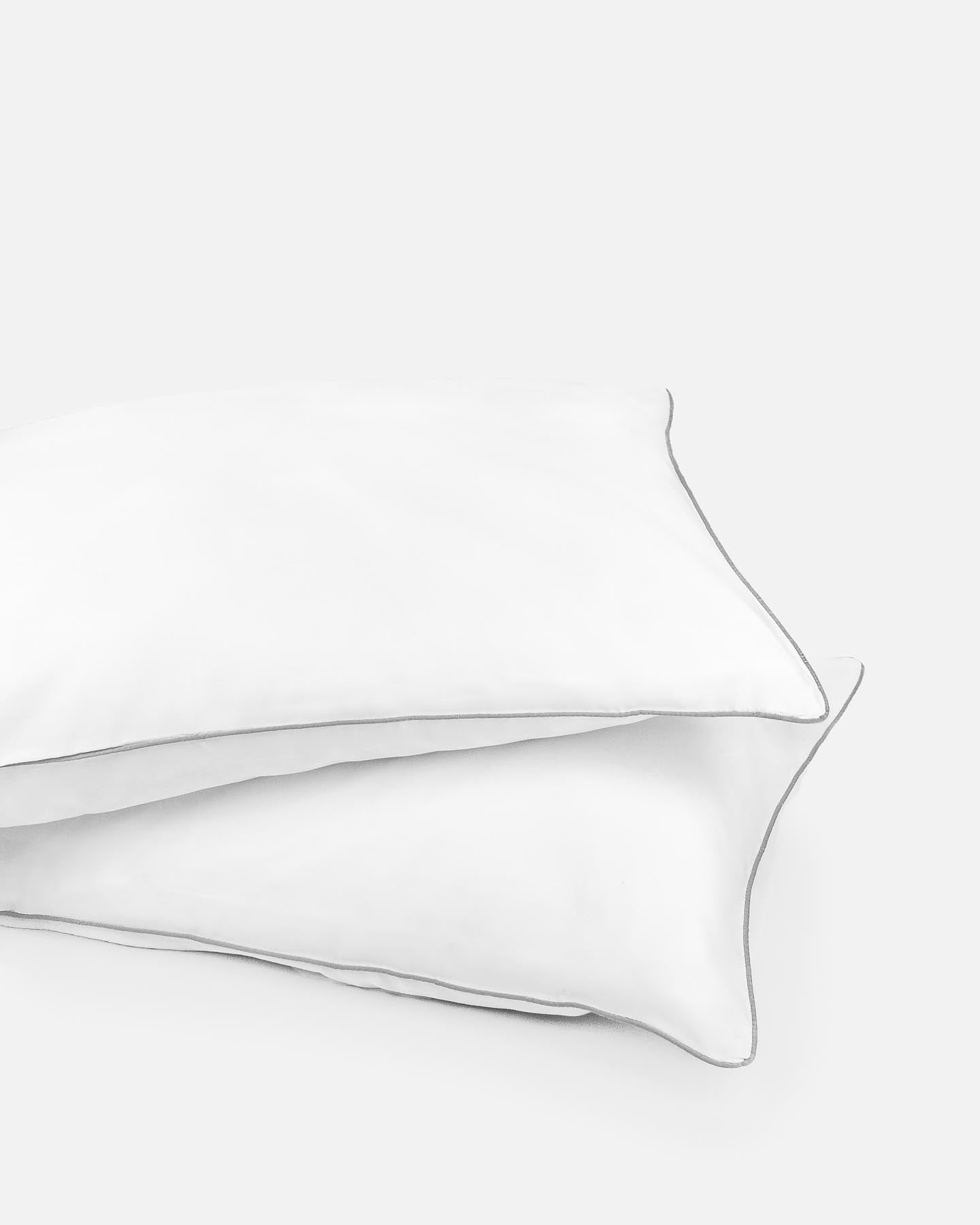 ava and ava ph organic bamboo lyocell pillowcaseswhite with gray piping. vegan silk, soft, cool, smooth, breathable.