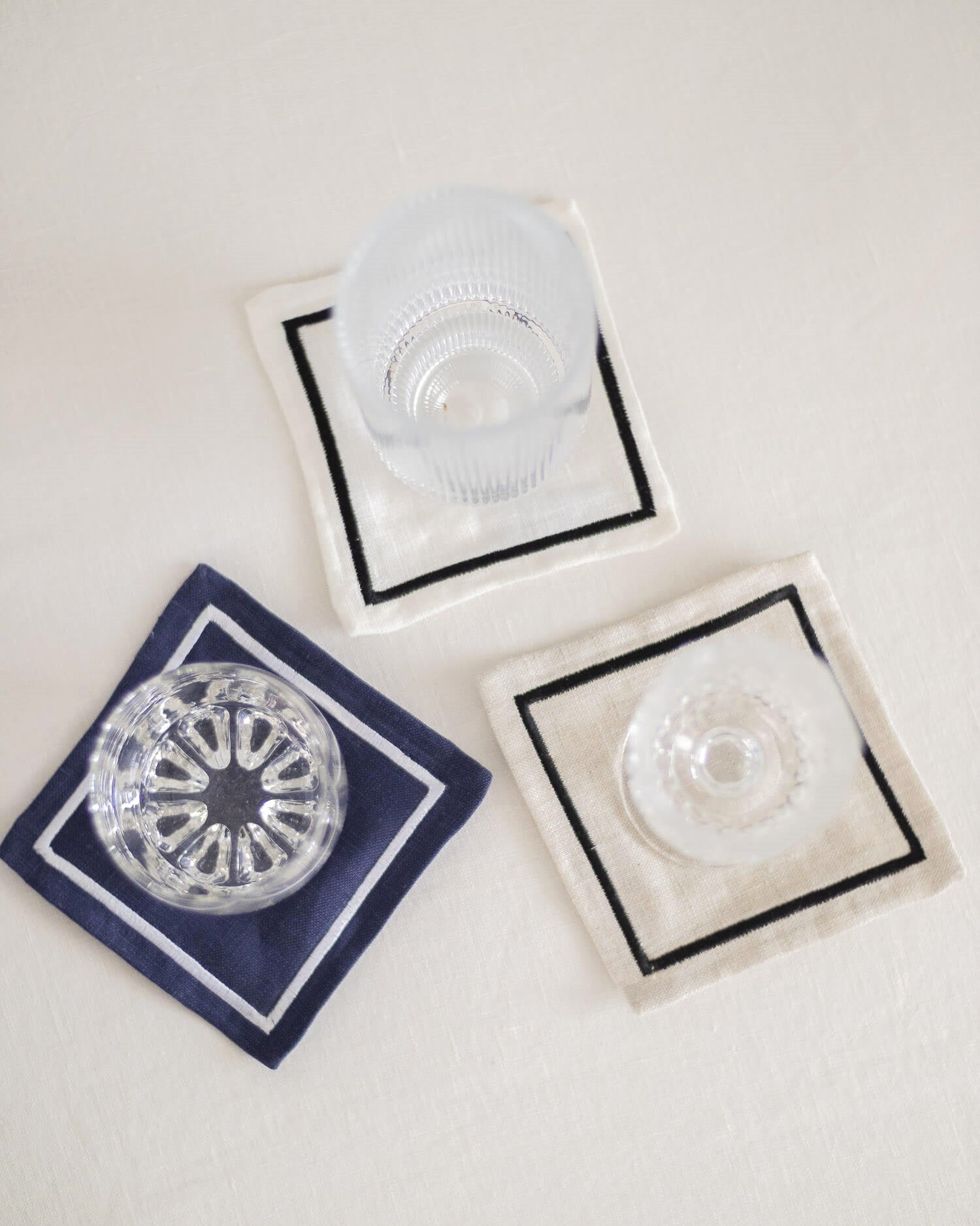 ava and ava organic pure linen embroidered coasters set  white natural navy with glasses drinks