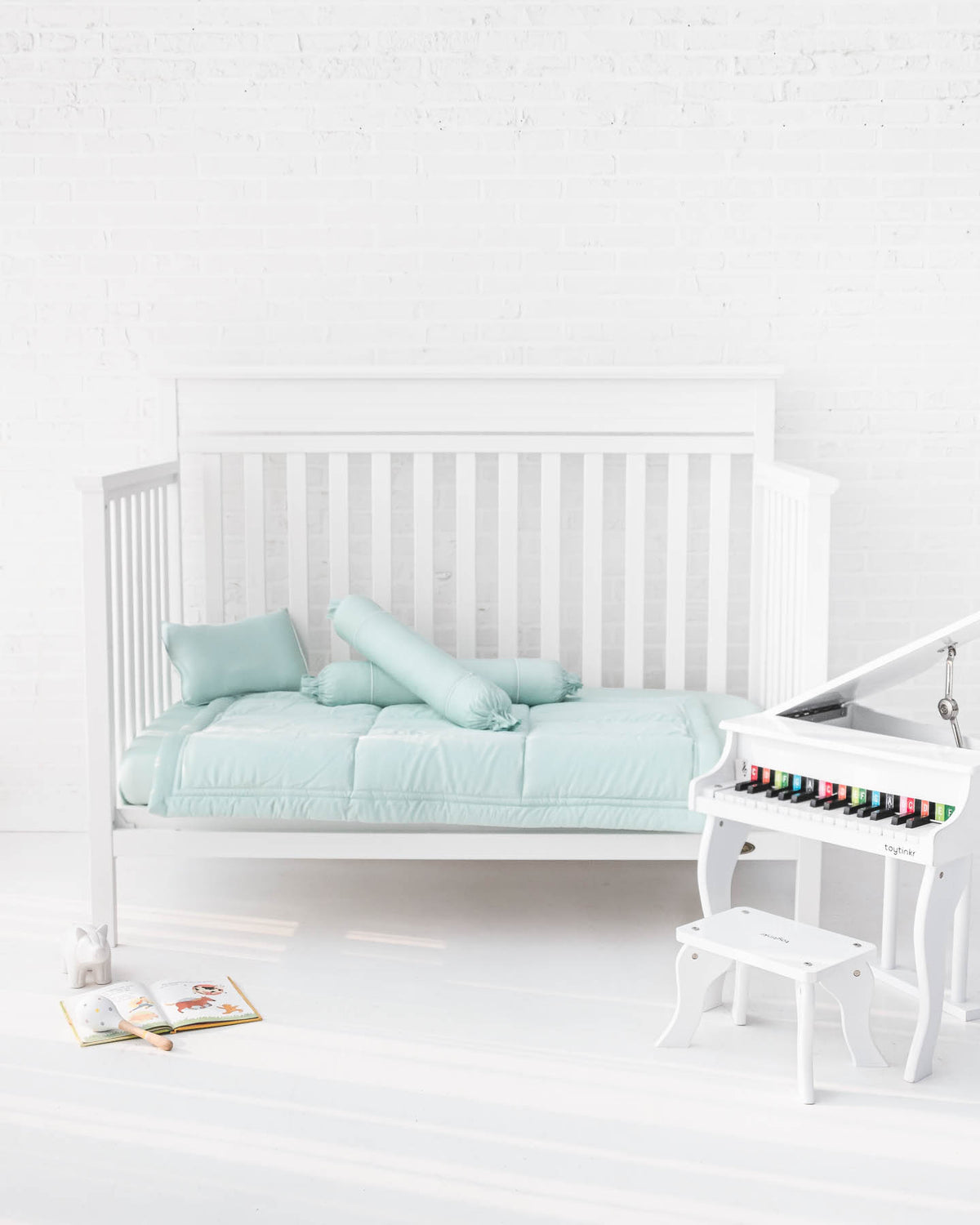 White crib with mint green organic bamboo lyocell baby bedding (baby comforter set - 1 pillowcase, 2 bolstercases, 1 comforter; baby pillow set - 1 headshaping pillow, 2 bolsters; crib fitted sheet)