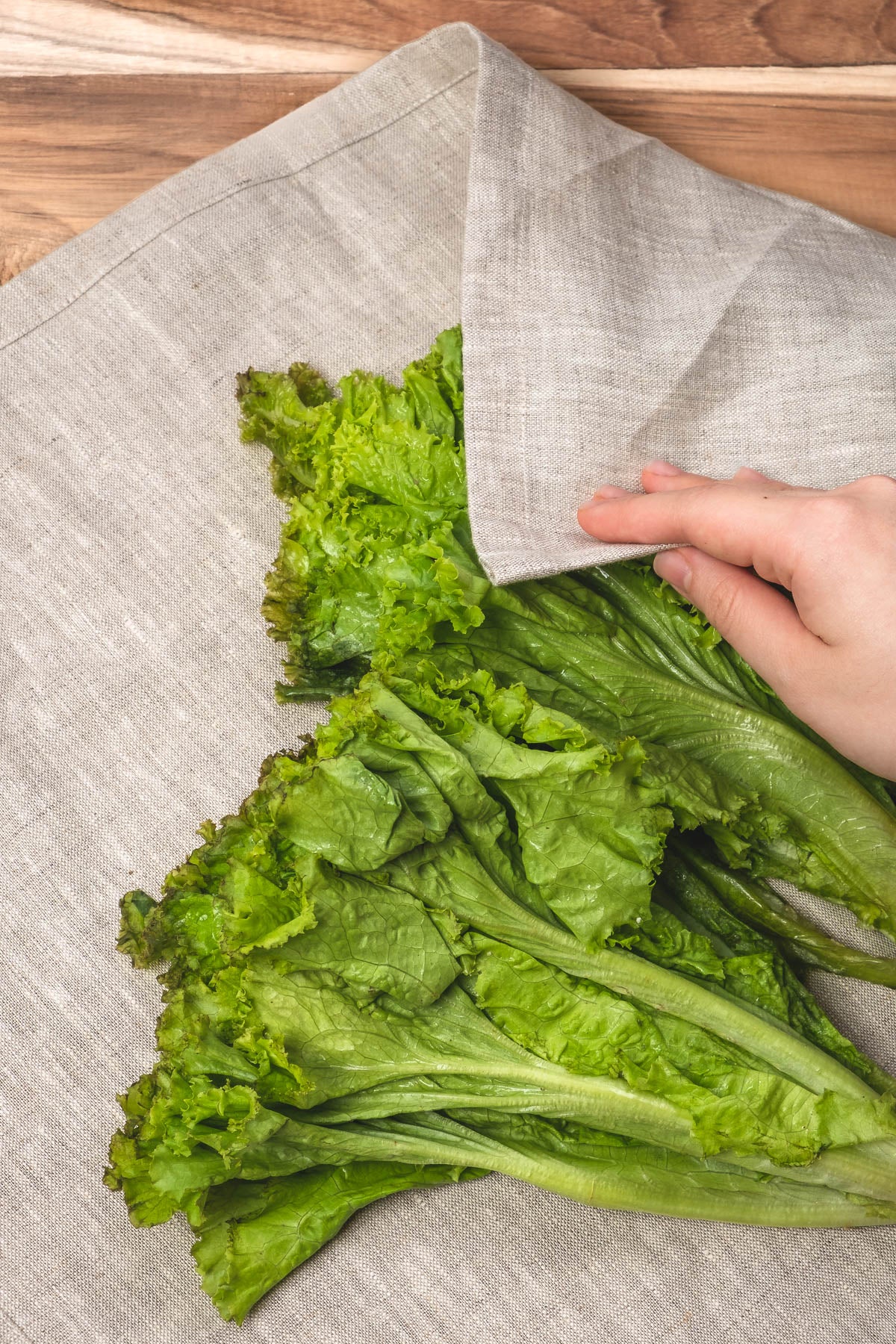 Natural linen apron used to pat lettuce greens dry