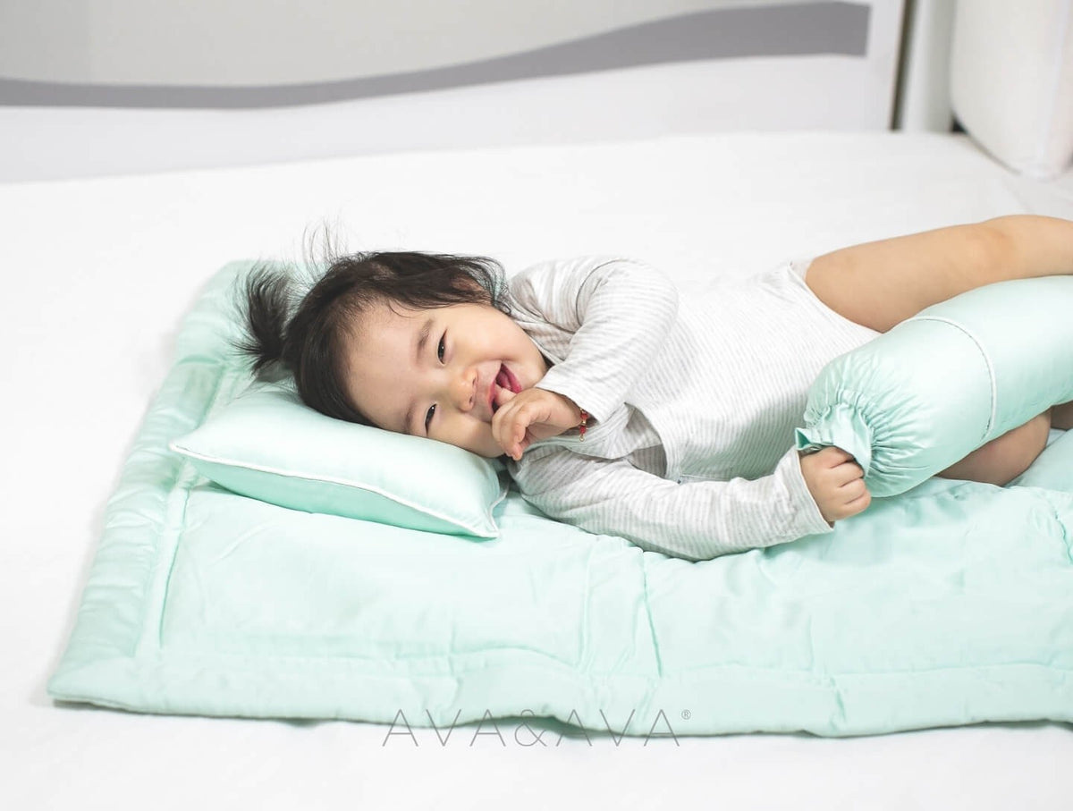 AVA & AVA white crib with mint green organic bamboo lyocell baby bedding (baby comforter set - 1 pillowcase, 2 bolstercases, 1 comforter; baby pillow set - 1 headshaping pillow, 2 bolsters; crib fitted sheet). baby laughing