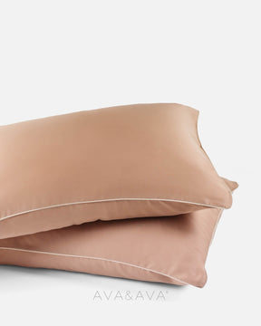 pair of organic bamboo lyocell pillowcases with AUTUMN CARAMEL OCHRE WITH BEIGE piping. ava and ava ph vegan silk, soft, cool, smooth, breathable pillowcases.
