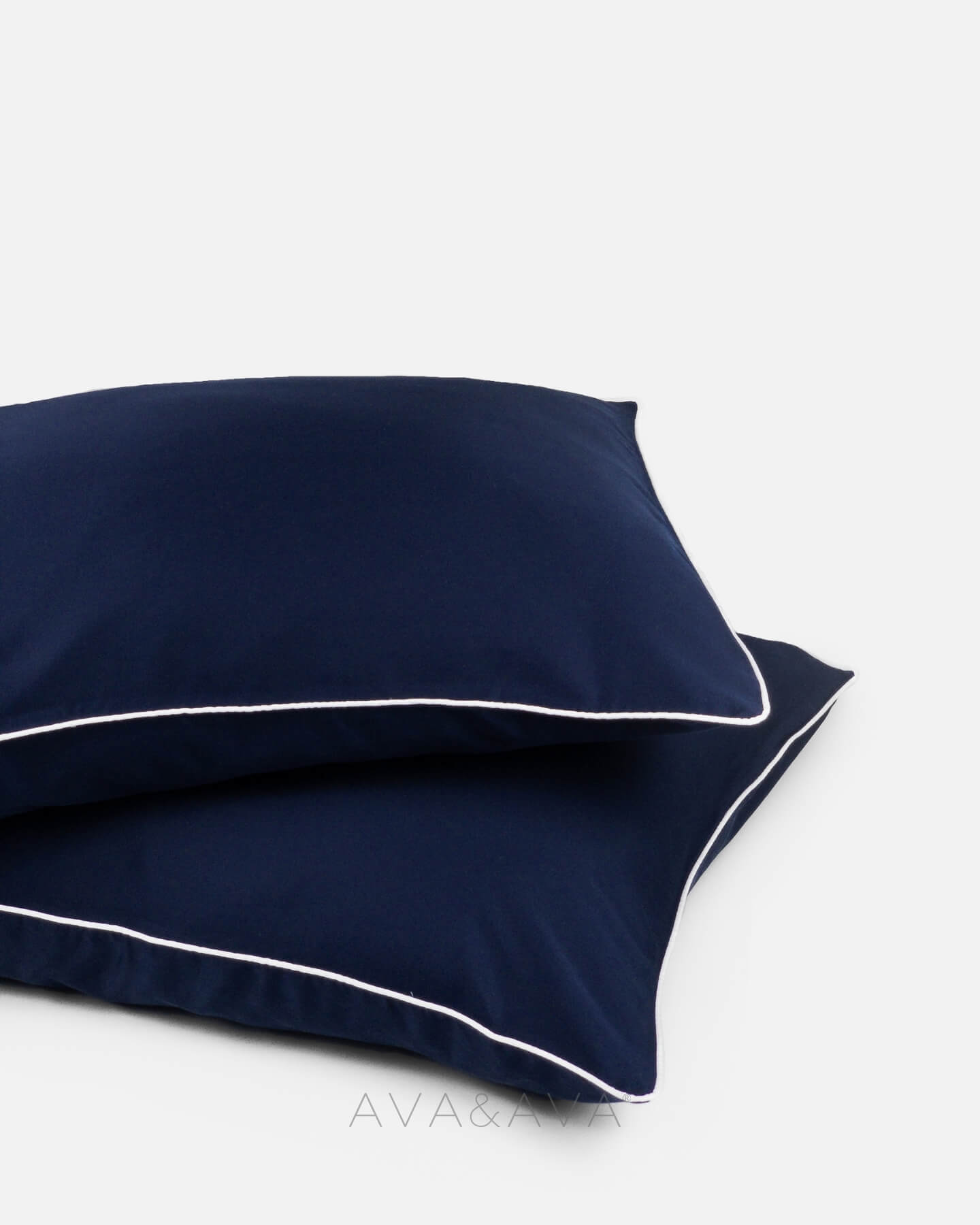 pair of organic bamboo lyocell pillowcases with NAVY BLUE OCEAN WITH WHITE piping. ava and ava ph vegan silk, soft, cool, smooth, breathable pillowcases.
