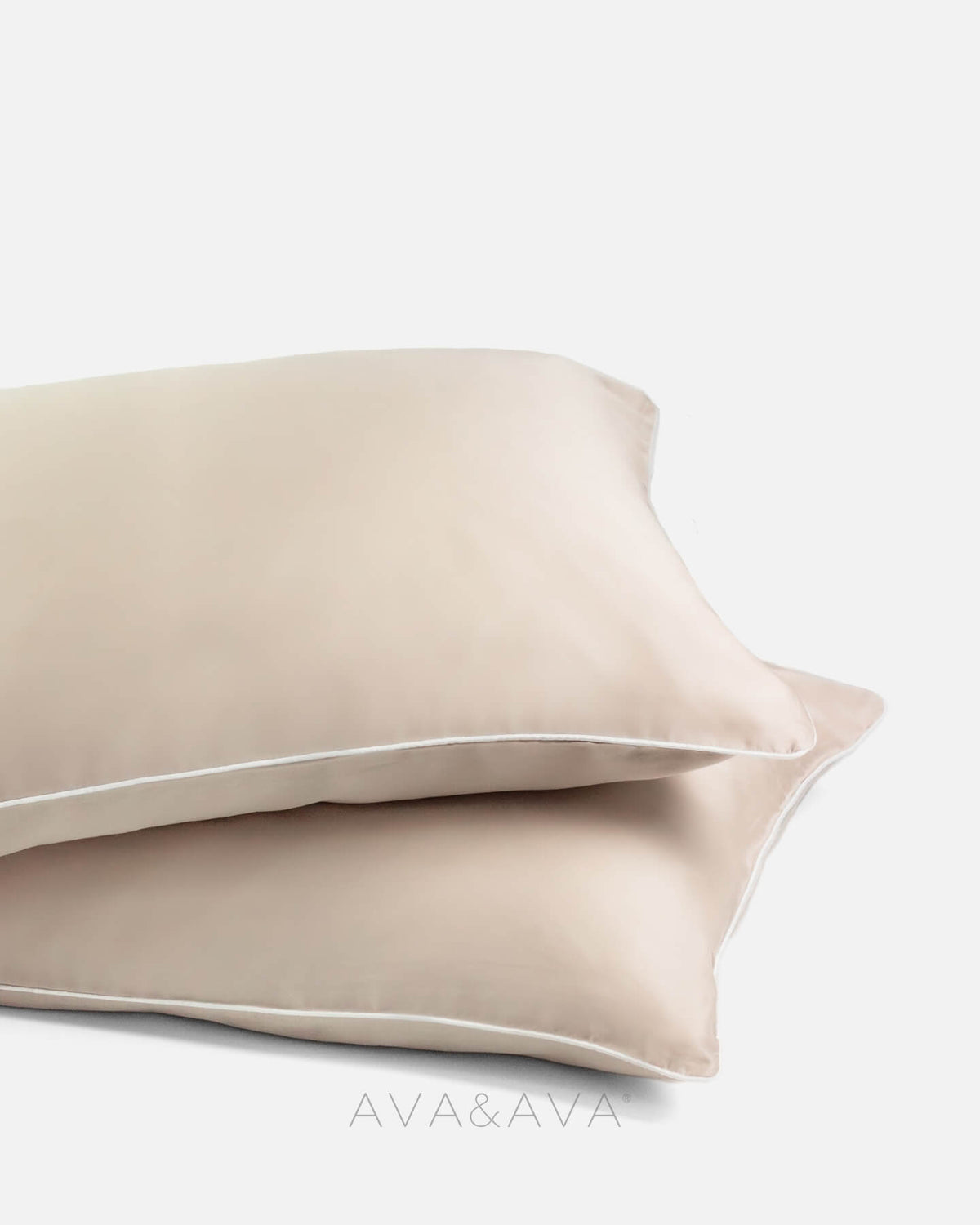 pair of organic bamboo lyocell pillowcases with NEUTRAL SAND BEIGE WITH WHITE piping. ava and ava ph vegan silk, soft, cool, smooth, breathable pillowcases.
