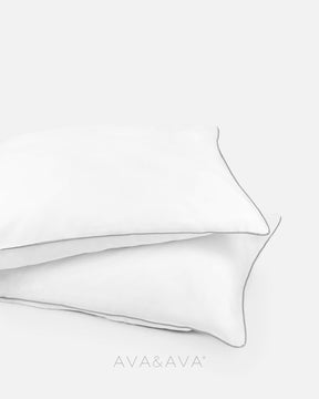 pair of organic bamboo lyocell pillowcases with WHITE WITH GRAY piping. ava and ava ph vegan silk, soft, cool, smooth, breathable pillowcases.
