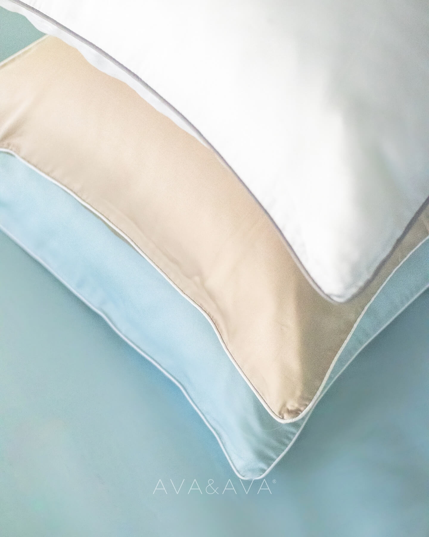stack  of organic bamboo lyocell pillowcases with piping detail - WHITE, SAND, BLUE. ava and ava ph vegan silk, soft, cool, smooth, breathable pillowcases.
