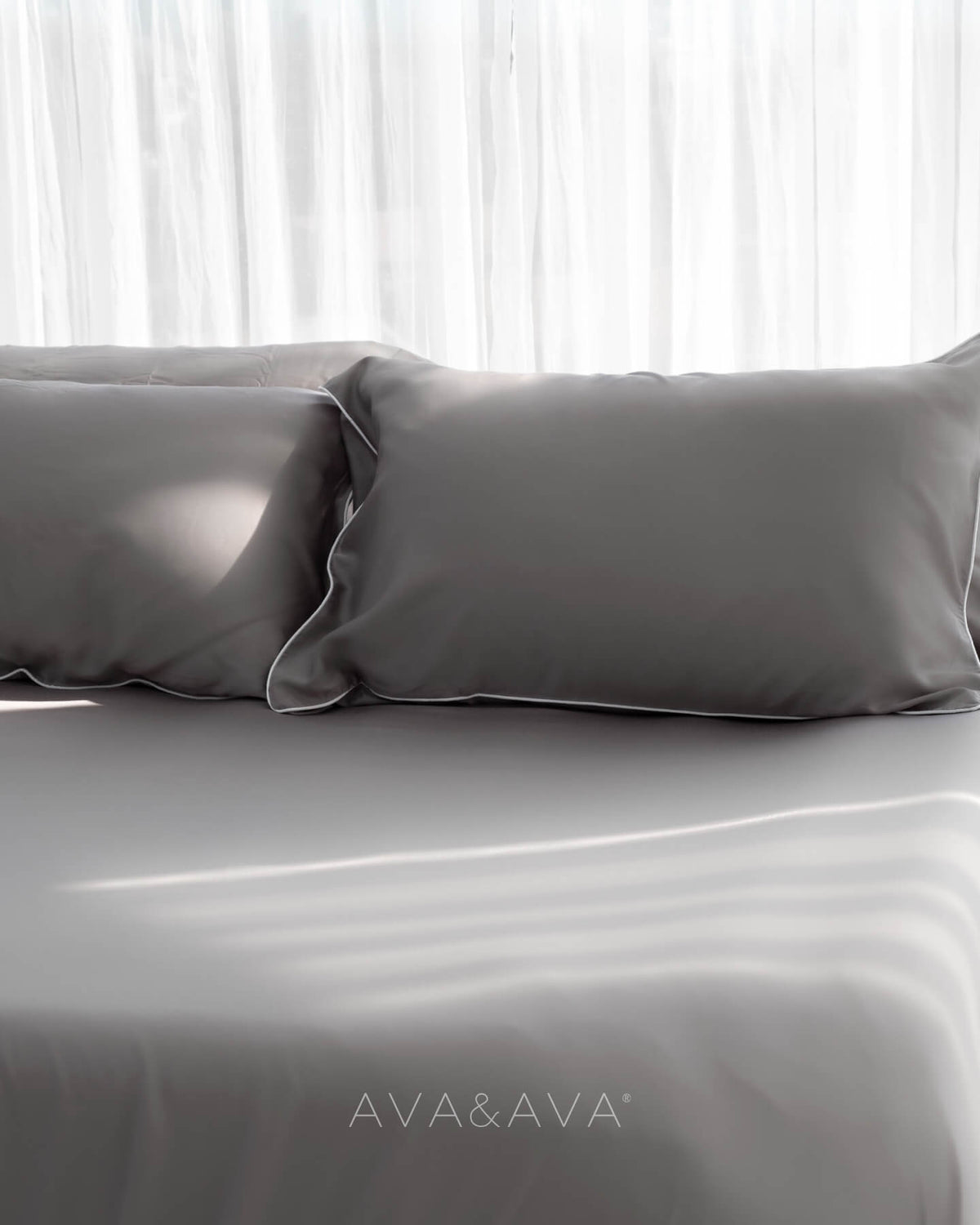 ava and ava ph organic bamboo lyocell 3pc sheet set (2 pillowcases 1 fitted sheet) in urban oasis (gray with white piping). ava and ava ph soft, cooling, breathable bed sheets.
