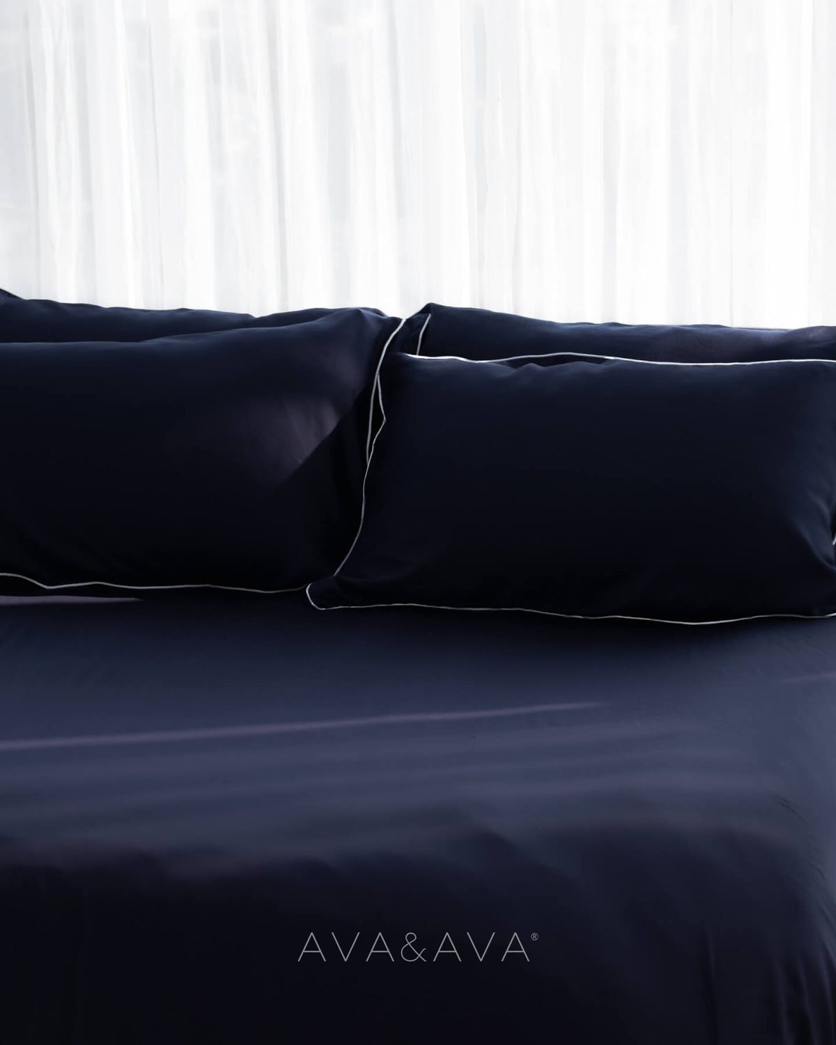 ava and ava philippines organic bamboo lyocell 3pc sheet set (2 pillowcases 1 fitted sheet) in ocean (navy with white piping). ava and ava ph soft, cooling, breathable bed sheets.
