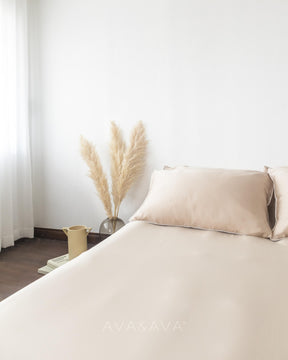 ava and ava ph organic bamboo lyocell 3pc sheet set (fitted sheet + pillowcases) in neutral beige sand hue with white piping. ultra soft, cooling and breathable bedding.
