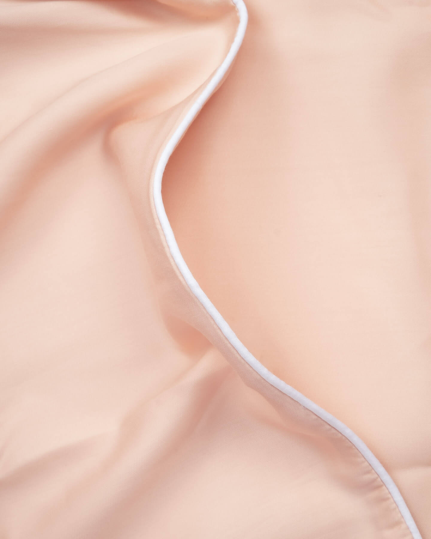pink organic bamboo lyocell duvet cover with white piping. ava and ava ph soft and cooling bedding sheets.