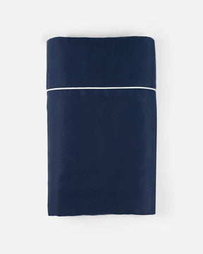 ava and ava ph organic bamboo lyocell flat sheet navy blue with white contrast piping at the top hem