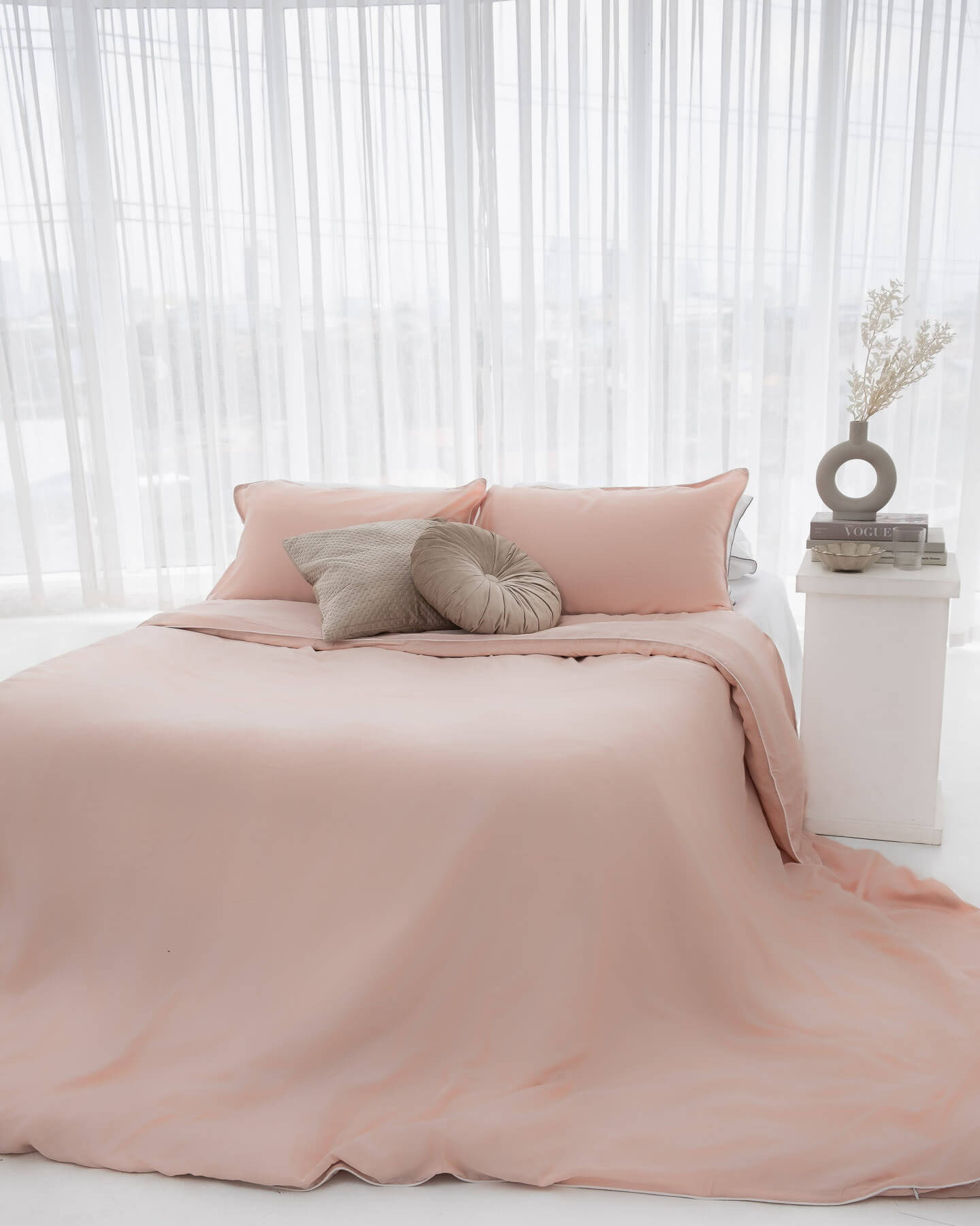 organic bamboo lyocell duvet cover and sheet set (fitted sheet and pillowcases) in silver lining (white with gray piping) and daydream blush (pink with white piping). ava and ava ph soft and cooling bedding sheets.