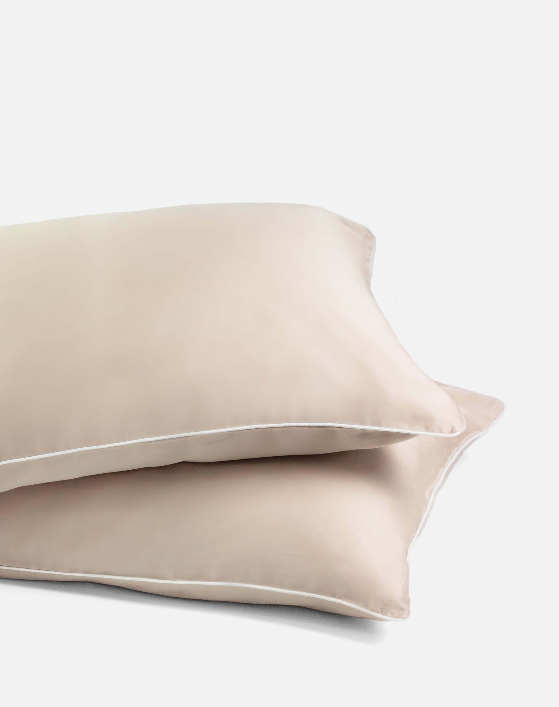 ava and ava ph organic bamboo lyocell pillowcases sand beige with white piping. vegan silk, soft, cool, smooth, breathable.