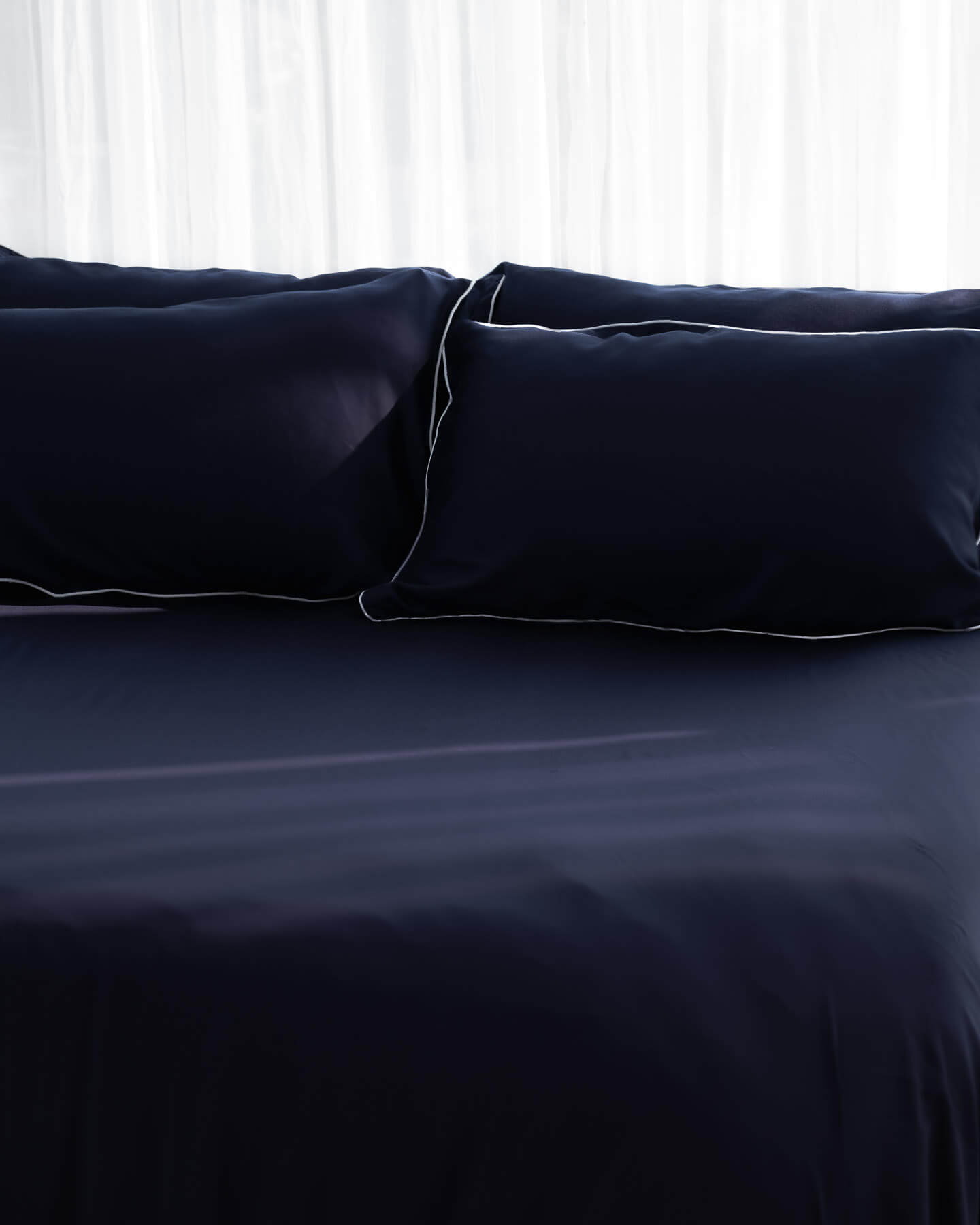 ava and ava philippines organic bamboo lyocell sheet set (2 pillowcases 1 fitted sheet) in ocean (navy with white piping). ava and ava ph soft, cooling, breathable bed sheets.
