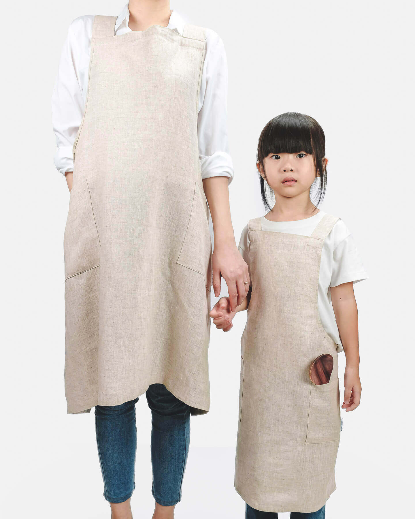ava and ava ph mother and child wearing natural colored pure linen crossback apron with pockets. outfit for cooking arts and crafts