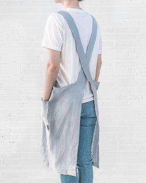 ava and ava ph sky blue pure linen crossback apron on female adult, crossback straps, no ties