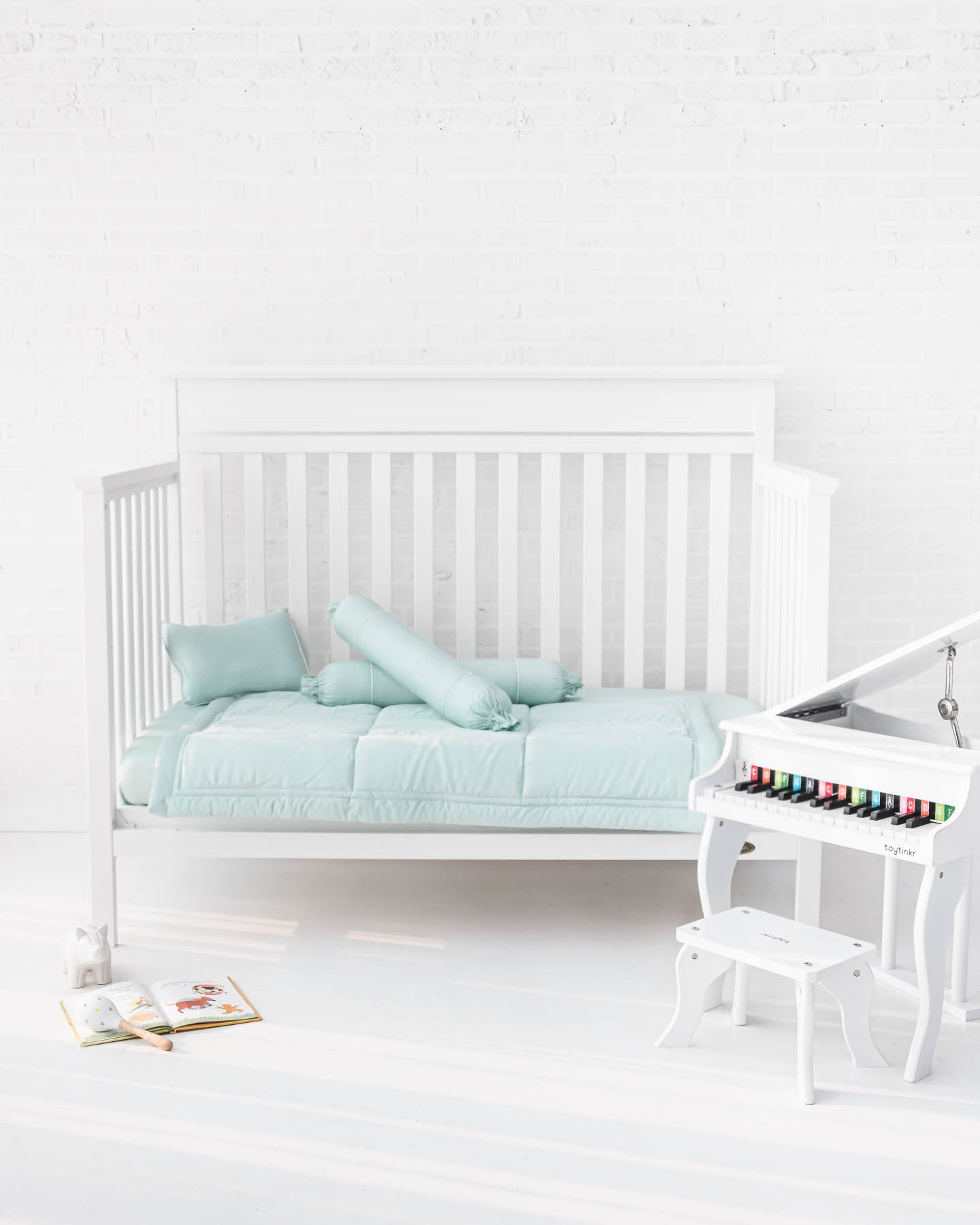 White crib with mint green organic bamboo lyocell baby bedding (baby comforter set - 1 pillowcase, 2 bolstercases, 1 comforter; baby pillow set - 1 headshaping pillow, 2 bolsters; crib fitted sheet)